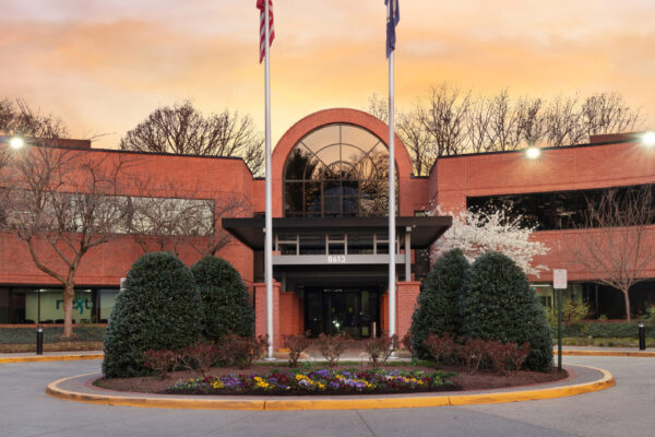 Virginia Cancer Specialists office exterior at dusk