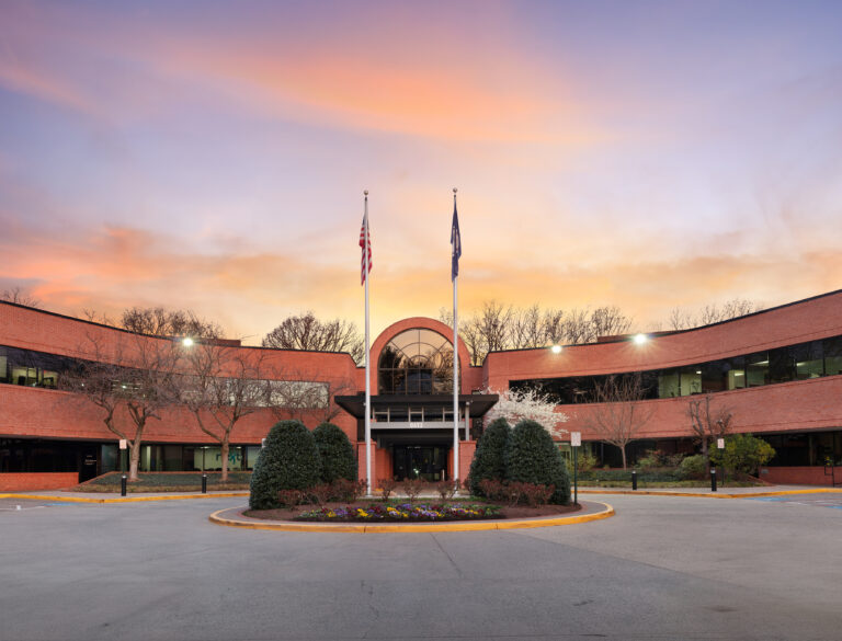 Virginia Cancer Specialists office exterior at dusk