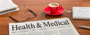 A newspaper on a wooden desk Health and Medical