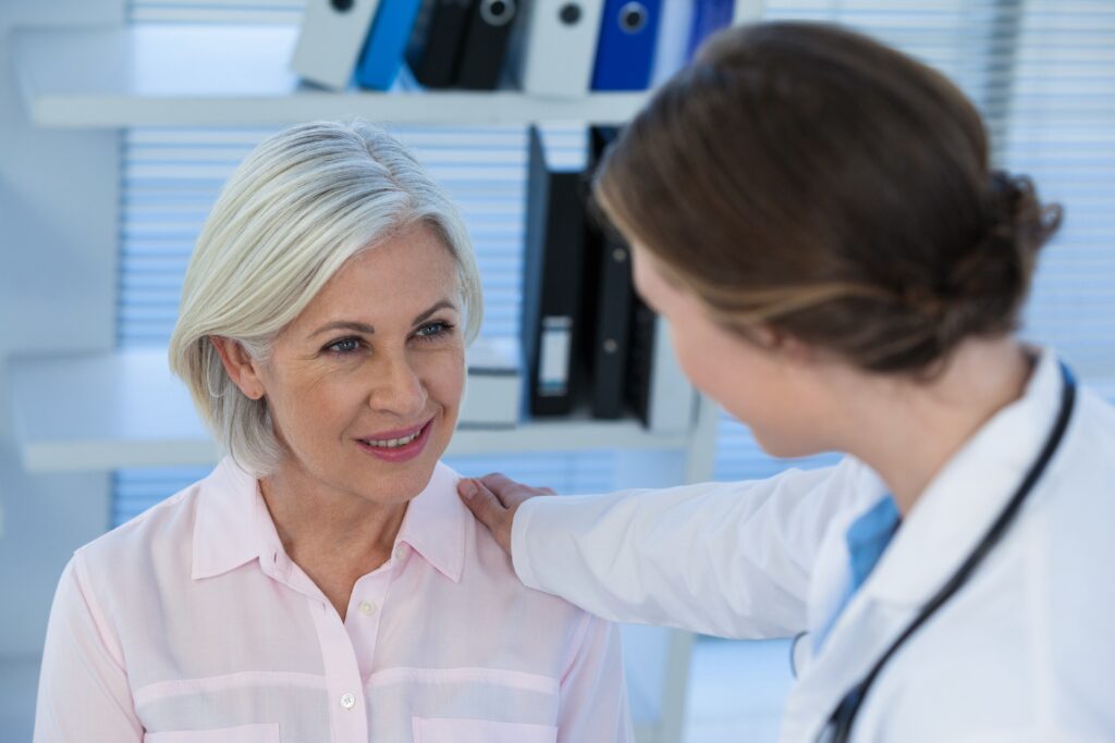 Close up of female doctor consoling a patient