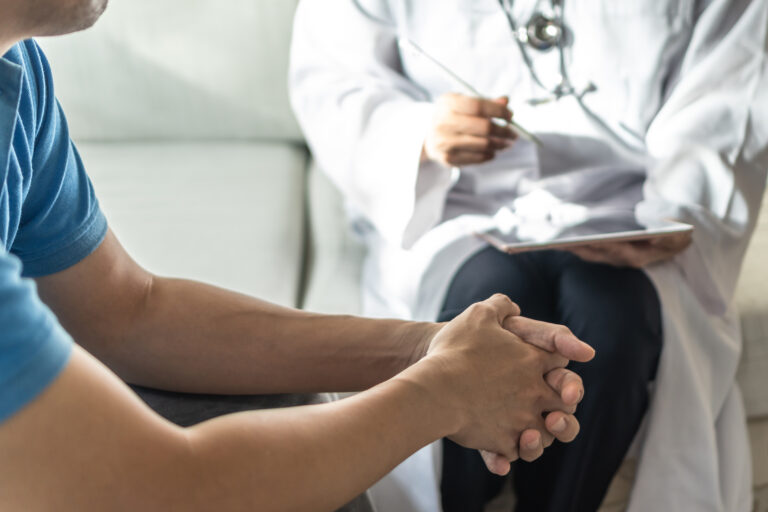 Men health disease or mental illness concept with male patient having consultation with doctor or psychiatrist working on diagnostic examination in...