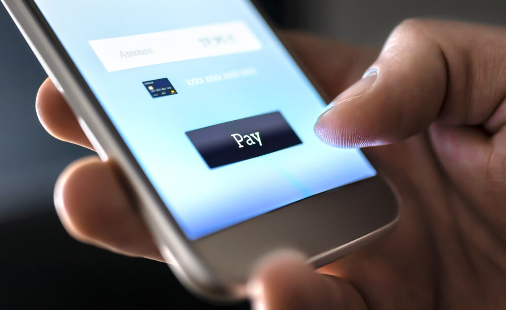 Mobile payment with wallet app and wireless nfc technology. Man paying and shopping with smartphone application and credit card information. Digita...
