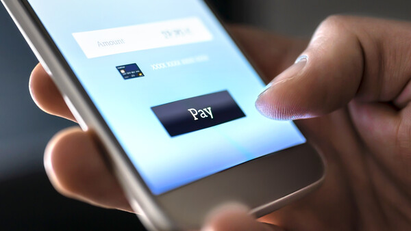 Mobile payment with wallet app and wireless nfc technology. Man paying and shopping with smartphone application and credit card information. Digita...