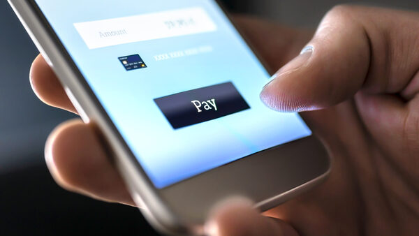 Mobile payment with wallet app and wireless nfc technology. Man paying and shopping with smartphone application and credit card information. Digita...