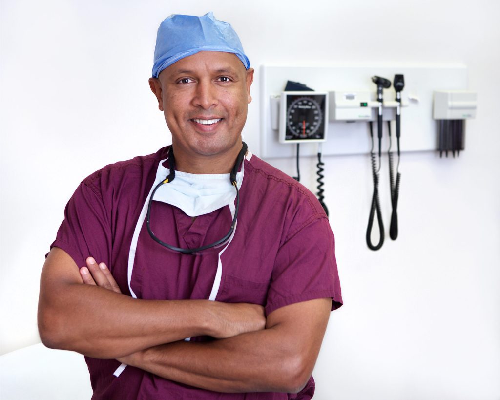 Felasfa M. Wodajo, MD, in scrubs